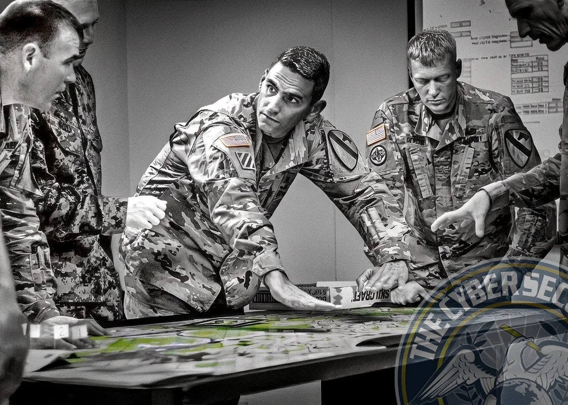 Military cyber planners designing a cyberspace operation around a planning table